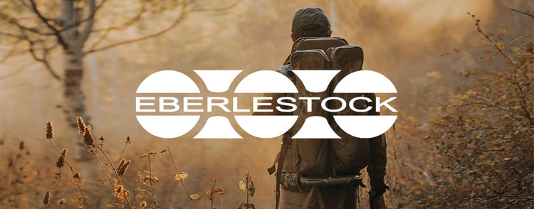 Eberlestock Logo vor Bild von Jäger in Morgendämmerung mit Rucksack